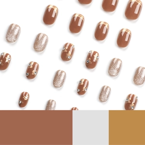 Maillard caramel brown false nails set with gold floral accents and silver glitter