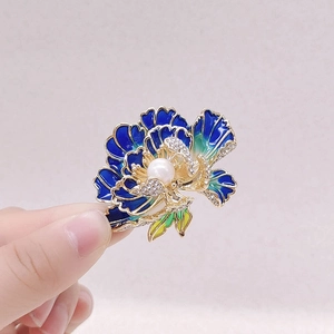 Exquisite blue enamel peony flower brooch with a central pearl and gold leaf accents