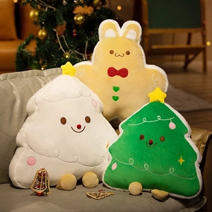 Cozy Christmas plush pillows featuring gingerbread rabbit and festive trees on a sofa