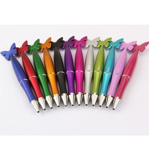 Detailed fan arrangement of thirteen colorful butterfly-shaped metallic ballpoint pens