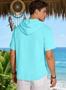 Rear view of cyan linen hooded short sleeve shirt for men in a tropical beach setting