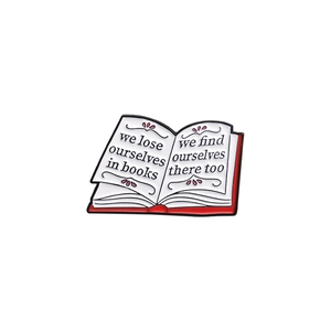 Cartoon enamel book brooch with red spine and inspiring English quote on white pages