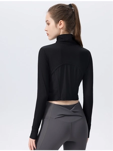 Back view of slim fit yoga top with ribbed fabric and arched hemline cut-out detail
