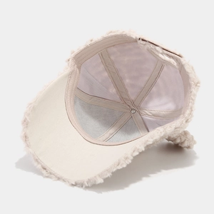 Detail of the soft plush baseball cap interior with reinforced straps and beige faux fur