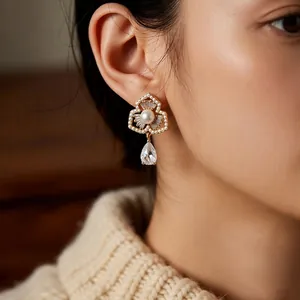 Elegant gold flower earrings with white pearl and teardrop crystals for women