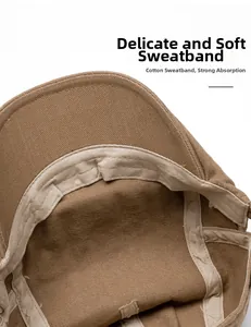 Detail of soft cotton beige sweatband inside a brown twill beret with neat stitching
