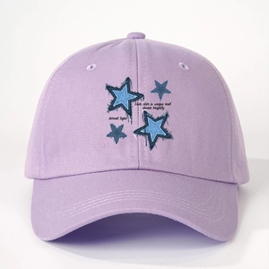 Purple baseball cap featuring blue star patterns and unique motivational English text