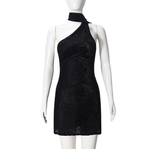 Detailed close-up of black one-shoulder mini dress with animal python texture