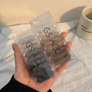 Spiral telephone cord hair ties in gradient grey and coffee colors with elegant packaging