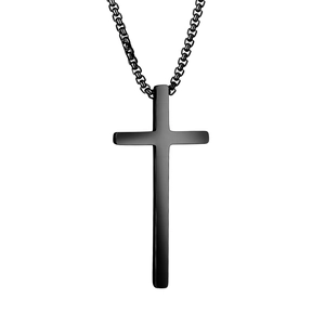 Detailed close-up of a minimalist black cross pendant with a matching curb chain