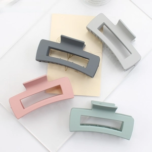 Detailed view of matte rectangular hair claws in four Morandi pastel color sets