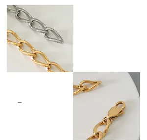 Detail of 18k gold and silver geometric thick chain bracelet with lobster clasp