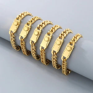 Polished gold curb chain bracelets with rectangle clasp on professional display