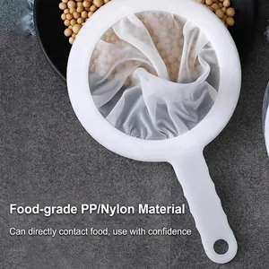 White fine mesh food strainer with PP handle for soy milk and juice on stone background