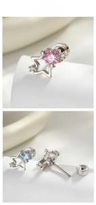 Detailed view of star-shaped titanium steel ear studs with pink and blue zircon stones