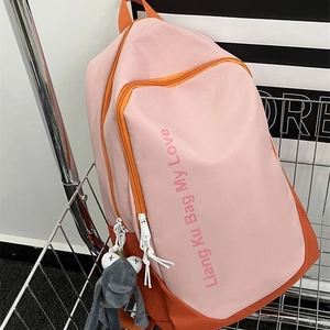 Pink and orange color-block nylon backpack with frog charm and casual school style