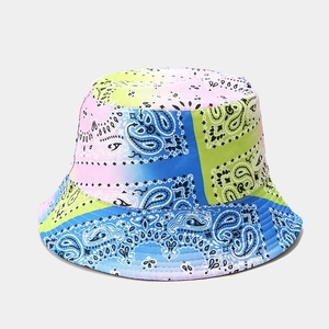Reversible bucket hat with colorful paisley tie-dye pattern and reinforced brim detail