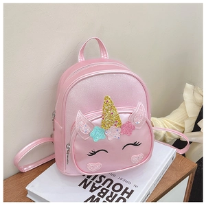 Close-up of pink unicorn backpack with glitter horn, stars and 3D ears detail