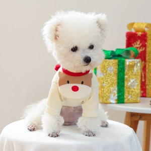 Close-up of knit dog sweater with 3D reindeer embroidery and festive texture