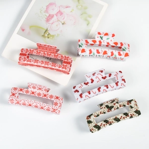 Set of 5 Christmas hair clips with snowflake, Santa hat, and candy cane patterns
