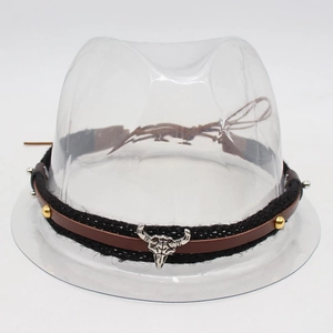 Detail view of retro western hat band featuring silver bull skull and leather braid