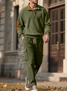 Detailed outdoor shot of green corduroy two-piece set with cargo pants and henley collar