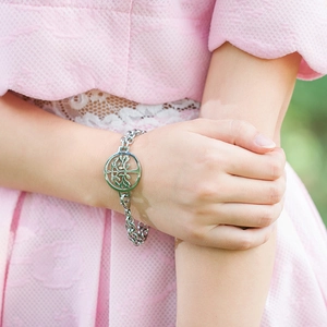 Women's stainless steel double-layer bracelet with life tree pendant on a model