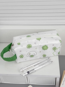 Detail of waterproof white pencil case with green handle and cute puppy clover pattern