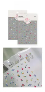 Macro detail of 5D embossed nail art stickers featuring colorful 3D floral patterns