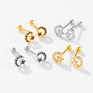 Detail of S925 sterling silver star and moon stud earrings with screw ball backs