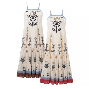 Bohemian floral printed maxi dress with spaghetti straps and ethnic style mesh patchwork