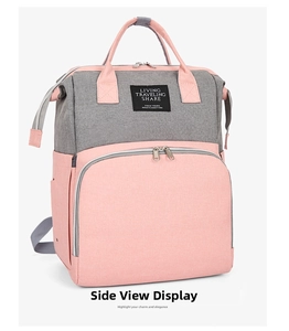 Side view of pink and grey Oxford cloth diaper backpack with multi-pocket design