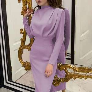 Detail of a purple slim-fit dress with high collar and elegant waist pleats