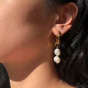 18K gold plated stainless steel hoop earrings with double freshwater pearl drops on model