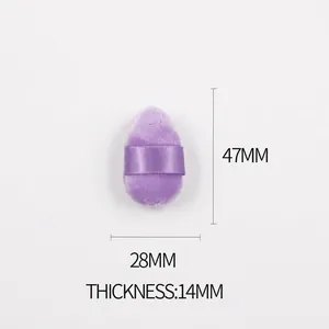 Detail view of mini purple velvet powder puff with size markers 47mm by 28mm dimensions