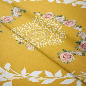 Detail shot of yellow floral tapestry with pink roses and bohemian mandala patterns