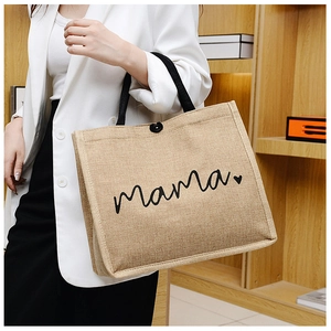 Detail of jute tote bag showing high-quality fiber texture and black button closure