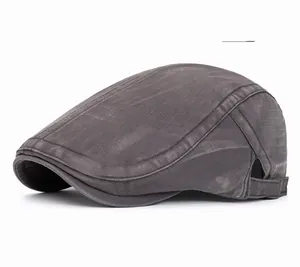 Detail of adjustable metal buckle on gray washed cotton flat cap with retro texture
