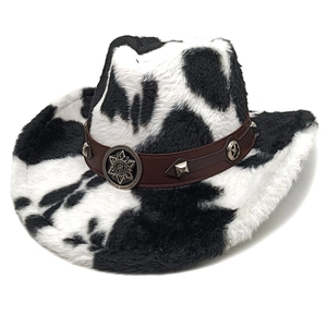 Detail of cow print plush cowboy hat with brown faux leather studded band and star badge