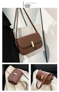 Detail view of a vintage brown crossbody bag with a polished gold rectangular clasp