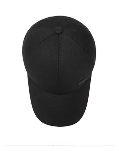 Top down view of a black baseball cap with twill texture and Sport rubber badge detail