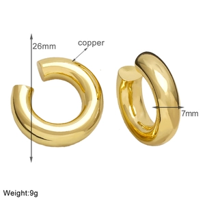 Detail of 26mm gold plated C-shaped ear cuff showing copper material and 9g weight specs