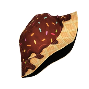 Detailed view of donut-themed bucket hat featuring chocolate glaze and waffle textures