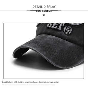 Detail of vintage washed cotton baseball cap with embroidered letters and reinforced brim