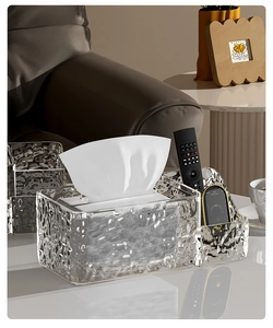 Detail of water ripple tissue box with compartments for remote and phone
