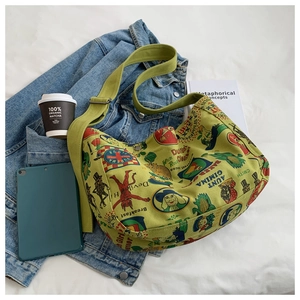 Retro fruit green canvas crossbody bag styled with casual outfit on a bed