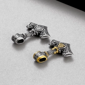 Norse Viking hammer pendants in silver and two-tone gold finish with relief patterns