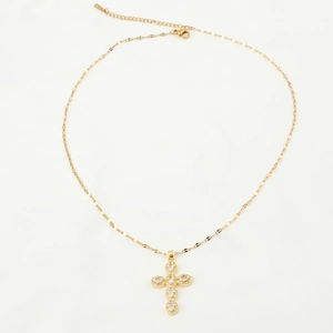 Detail of gold-plated cross pendant with sparkling zircons and lobster clasp closure