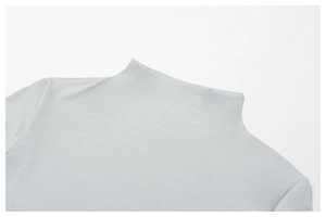 Detailed close-up of seamless high neck stitching on light blue quick-dry yoga top