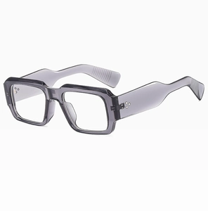 Macro view of transparent grey square frame sunglasses with metal rivet details